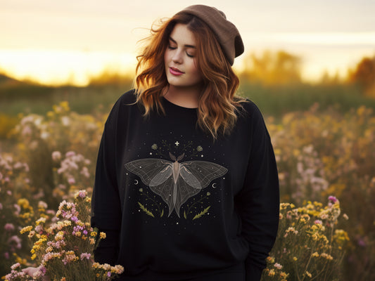Black sweatshirt featuring a beautiful midnight moth design with a magical vibe