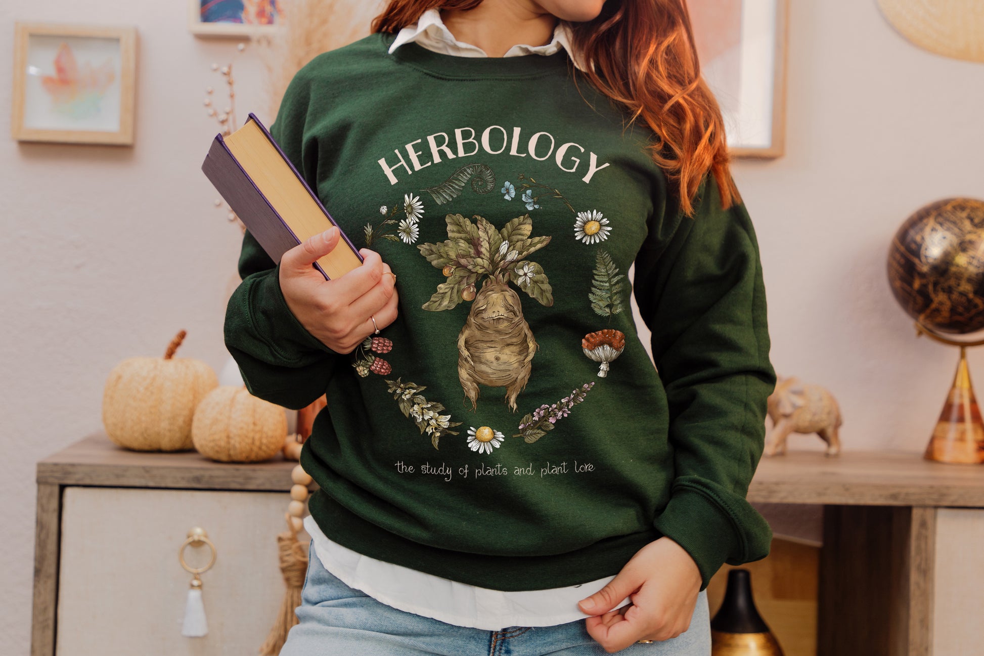 Forest Green Sweatshirt with Herbology Design featuring a baby mandrake.