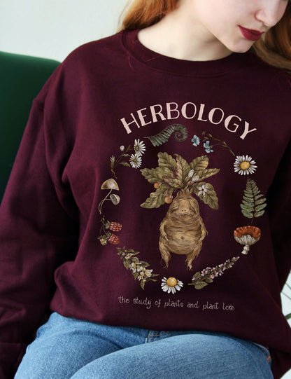 Maroon Sweatshirt with Herbology Design featuring a baby mandrake.